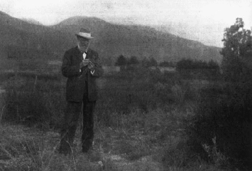 Photograph with this caption: A study of John Muir in the
Yosemite.  Those who know him well will recognize a
characteristic pose of this lover of nature.