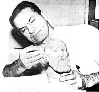 Artist Rudolph Wendelin at work on a bust of Muir