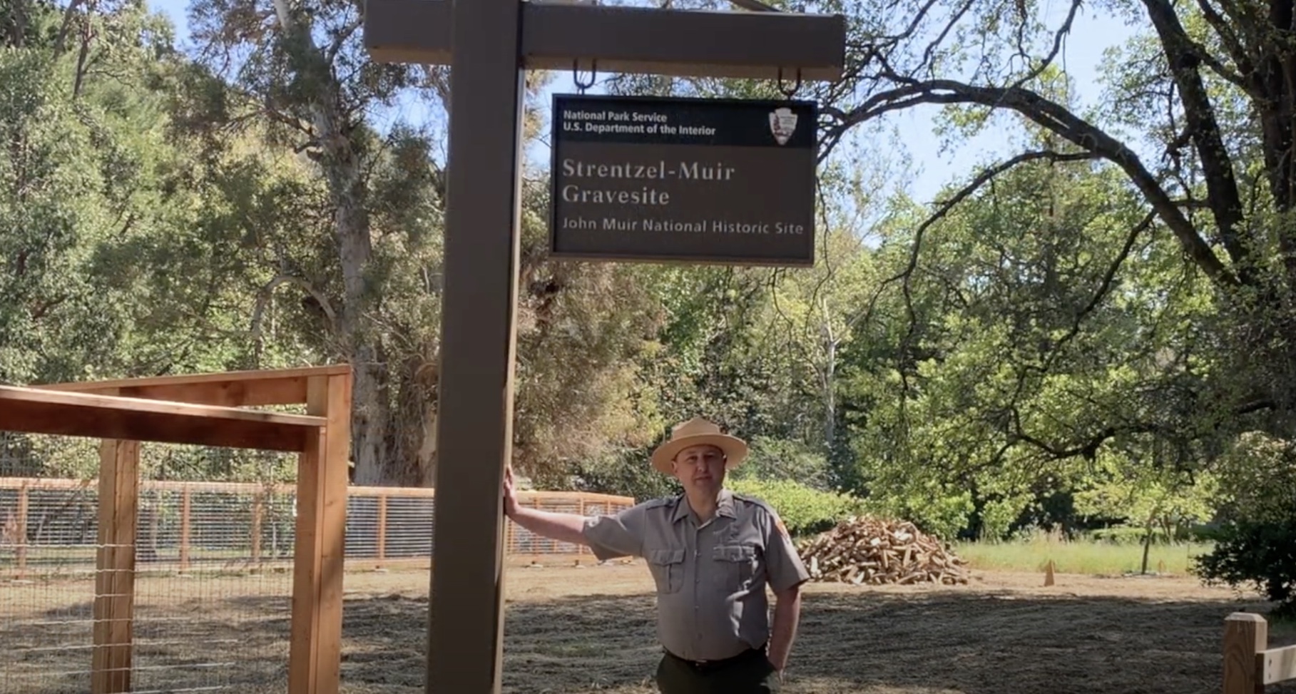Tom Leatherman, Superintendent of John Muir National Historic Site, shows new signage and fencing at the gravesite, 2021